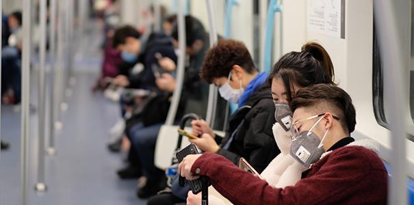 People wearing masks on a train in China