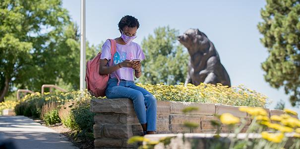 Student using phone on campus